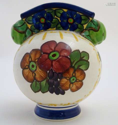 An Alumina faience globular vase with a squared rim and floral decoration. Marked under with