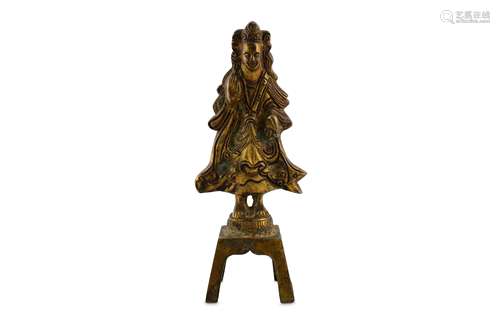 A GILT-BRONZE STANDING FIGURE.