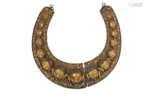 A TIBETAN GILT-COPPER GARLAND.