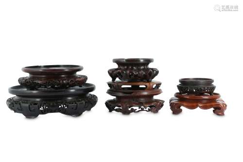 § SEVEN CHINESE CIRCULAR WOOD STANDS.