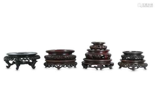 EIGHT CHINESE CIRCULAR WOOD STANDS.