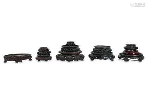 A COLLECTION OF CHINESE WOOD STANDS.