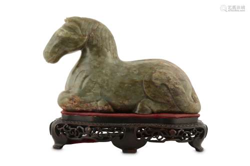 A CHINESE PALE CELADON JADE CARVING OF A HORSE.