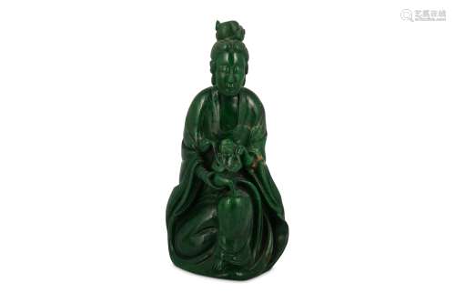 A CHINESE GREEN STONE FIGURE OF GUANYIN WITH A BOY.