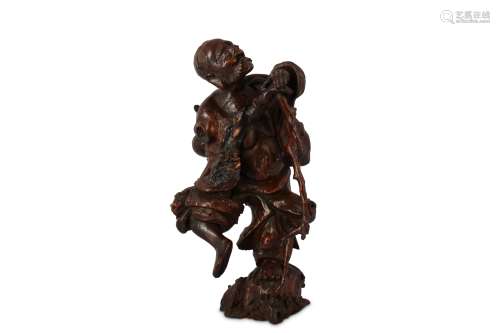 A CHINESE ROOT WOOD FIGURE OF AN ARHAT.