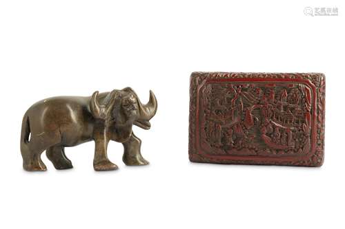 A CHINESE CINNABAR LACQUER BOX AND COVER AND A SOAPSTONE BUFFALO CARVING.