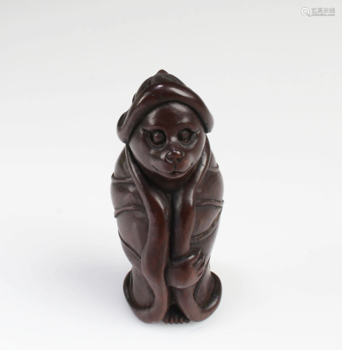 A Carved Wooden Figurine