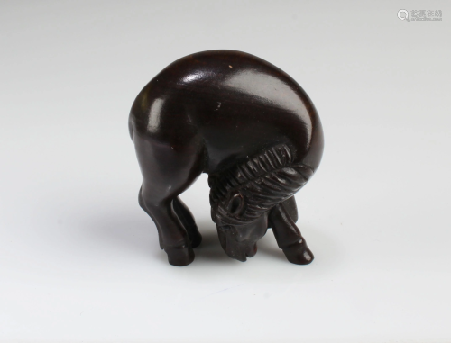 A Carved Wooden Animal Figurine