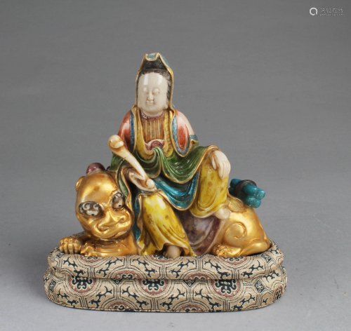 A Carved Polychrome Soapstone Guanyin Statue
