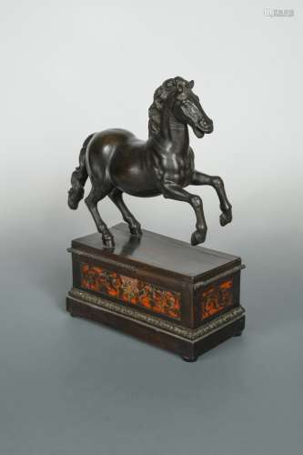 A bronze model of a prancing horse, probably 18th century,