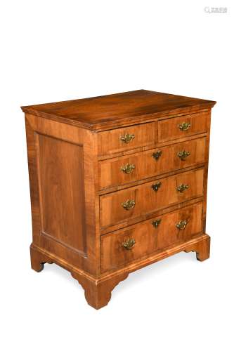 A walnut veneered and cross banded chest,