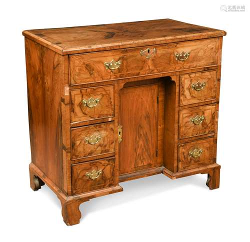 A George II walnut kneehole desk,