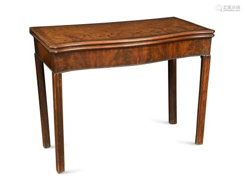 An early George III mahogany serpentine concertina action card table,