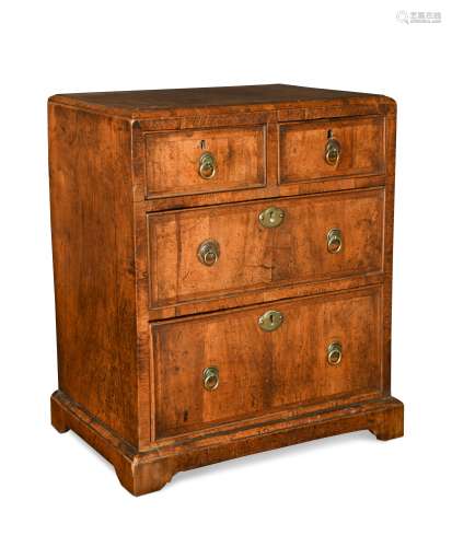 A George II walnut and cross banded miniature chest, circa 1730,