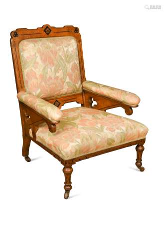 An Aesthetic period inlaid oak library armchair,