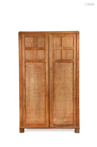 A Heal's limed oak Cotswold style fitted wardrobe circa1925,