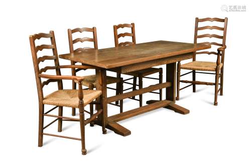 Attributed to Heal's, a limed oak Cottage style refectory dining table and four chairs,
