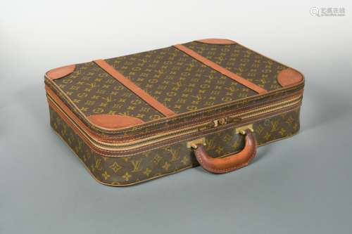 A small Louis Vuitton semi-rigid case,