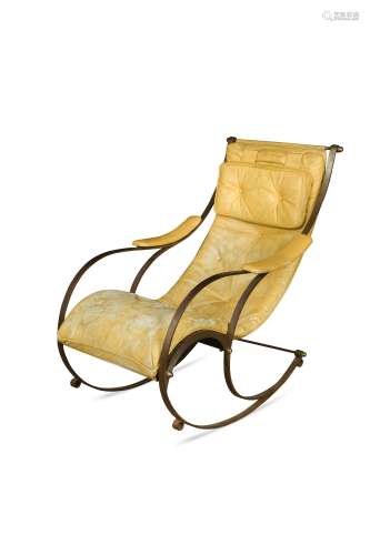 An early 20th century bent steel rocking chair in the manner of R. W. Winfield,