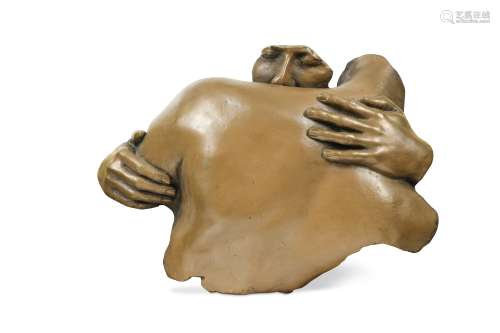 A contemporary bronzed moulded wall relief of an embrace,
