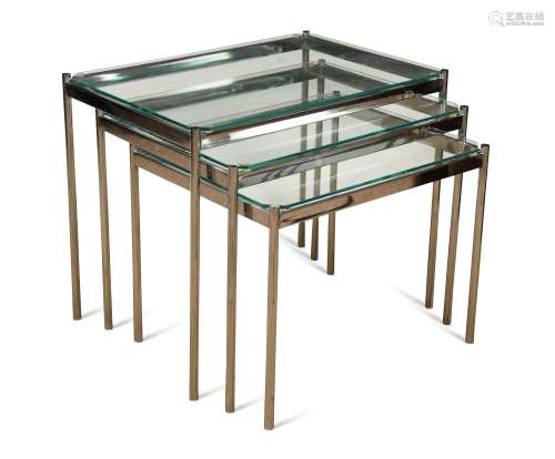 A nest of three glass topped chrome tables, circa 1970s,