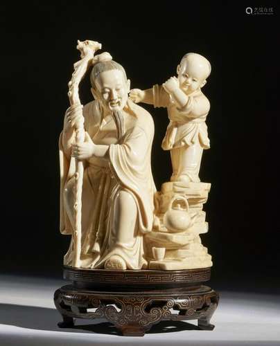 Chinese Art. An ivory group depicting an old man w…