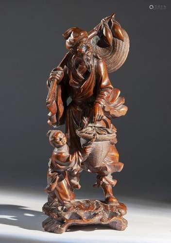 Chinese Art. A wooden sculpture depicting an old f…