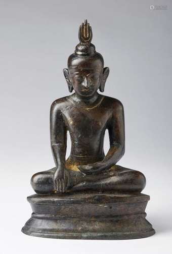 South Est Asian Art. A dark bronze figure of seate…