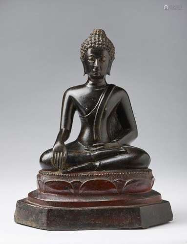 South Est Asian Art. A dark bronze figure of Buddh…