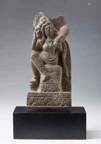 Indian Art. A grey schist plaque carved with a lad…