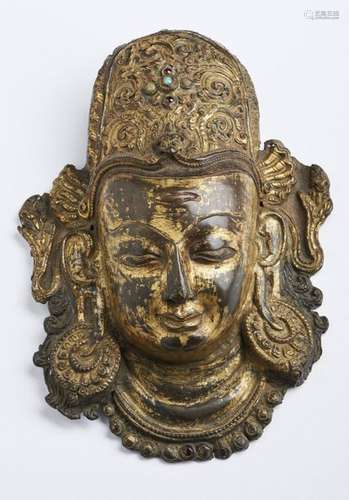 Himalayan Art. A copper embossed Indra head Nepal,…