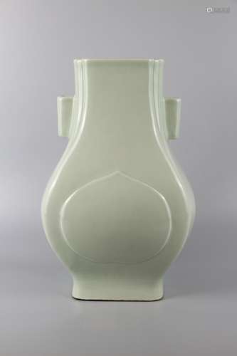 A BEAN-GREEN GLAZE BOTTLE WITH PIERCED HANDLES