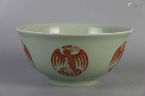 AN ALUM RED BOWL WITH PHOENIX PATTERNS