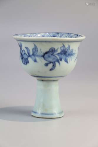 Cup decorated with blue and white flowers and birds