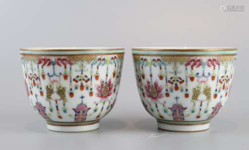 A pair of tea cups decorated with famille rose