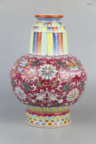 A vase decorated with famille rose flowers