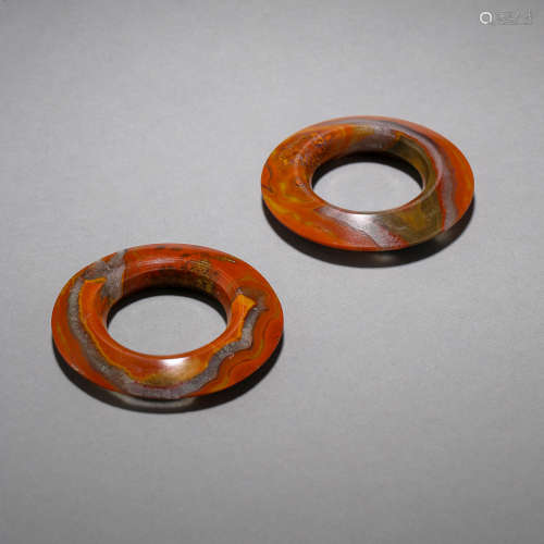A PAIR OF ANCIENT CHINESE AGATE RINGS