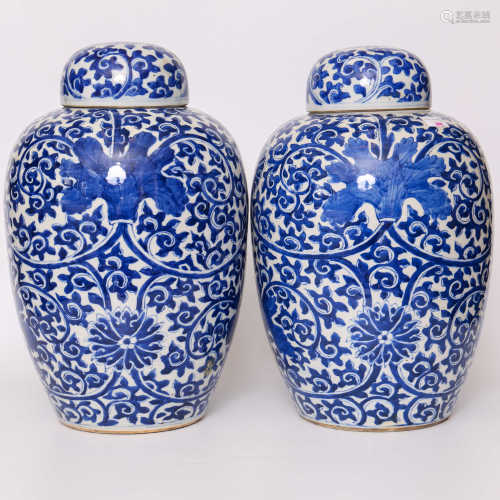 A pair of blue and white lotus flower decorative pots