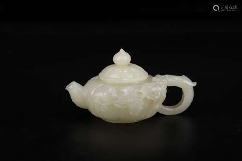 A Chinese Hetian Jade Teapot Of Floral Carving
