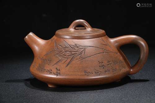 A Chinese Zisha Teapot Of Poetry Carving