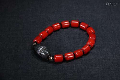 A Chinese Red Agate Bracelet With Dzi