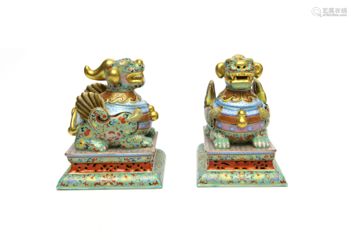 A Pair of Chinese Famille Rose Porcelain Lion Or…