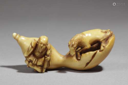 A 19th century Japanese netsuke. Signed Tomochika