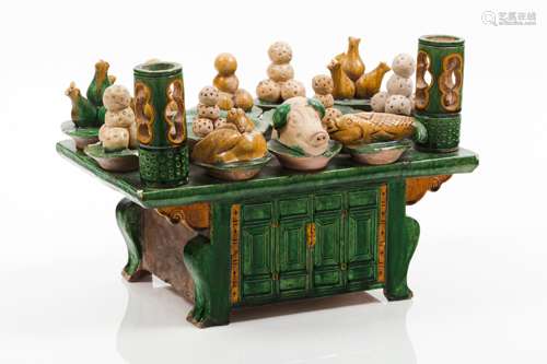 A sancai glazed model of an altar table with offerings