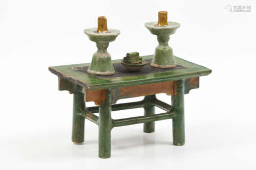 A sancai glazed model of a table with candlesticks