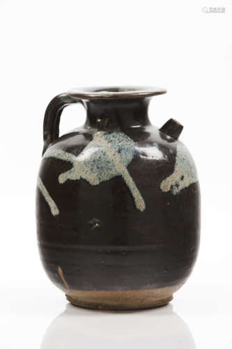 A phosphatic-splashed brown glazed stoneware ewer