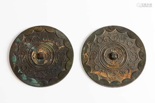 A pair of bronze mirrors