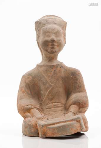 A Sichuan terracotta sculpture of a seated figure