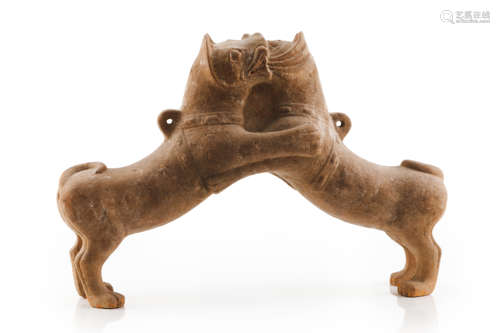 A rare sculpture of two fighting dogs