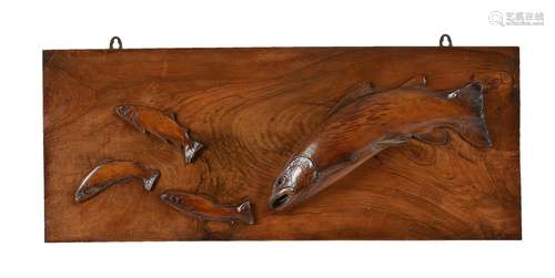 A carved and stained walnut and beech wall panel